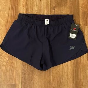 New balance 3in 2n1 woven work out shorts. New with tags. Size medium.
